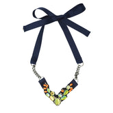 Enamel green and orange stones