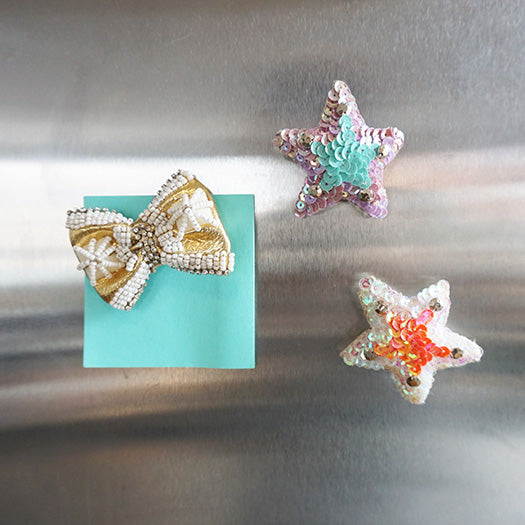 Blue and pink sequin star, gold ribbon