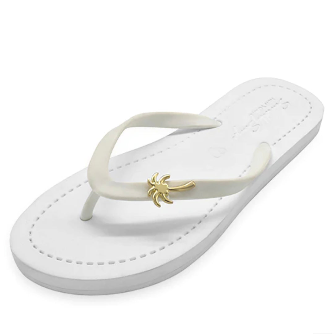 white flip flops with gold palm tree studs